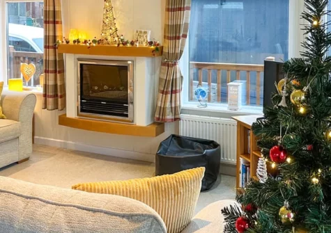 Grandma's Stick House at Mullacot Park, Mullacott is a peaceful single-storey lodge sleeping six guests, featuring wraparound decking with distant sea views, three comfortable bedrooms, and easy access to Ilfracombe and Woolacombe's beaches.