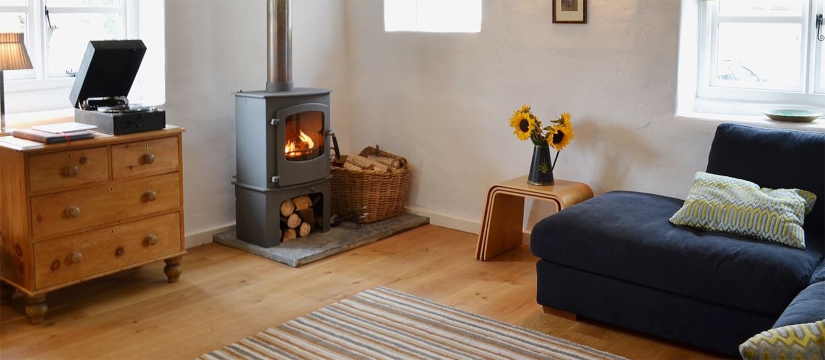 Granny McPhee's Cottage, Chilla is a romantic barn conversion for 2. Sitting room with beams and logburner, spacious bedroom, luxury bathroom & stylish kitchen. It has a beautiful private garden with hot tub, lawns and patio sun trap for relaxing.