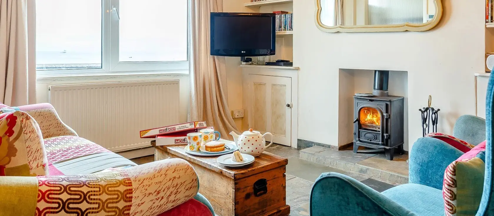 Guillemot Cottage, Brixham is a charming three-storey fishermen's retreat with stunning harbour views. Enjoy shabby-chic interiors, cosy wood burner, and prime traffic-free location metres from the quayside, perfect for coastal escapes.