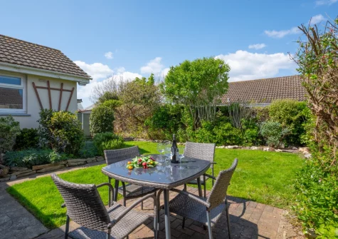 The patio, alfresco dining area & enclosed garden at Gull Cottage, St Merryn