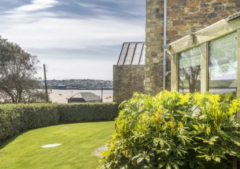 The enclosed lawned garden, with esturay views, at Gull Rock, Rock