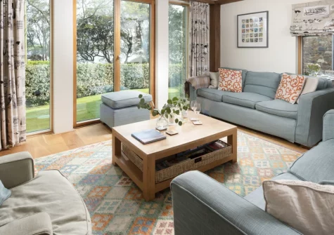 Gull Rock, Rock is a stunning four-bedroom family home boasting sweeping views over the River Camel, a sun-drenched garden with decking, elegant interiors, and space for eight guests, ideal for a truly memorable dog-friendly Cornish escape.
