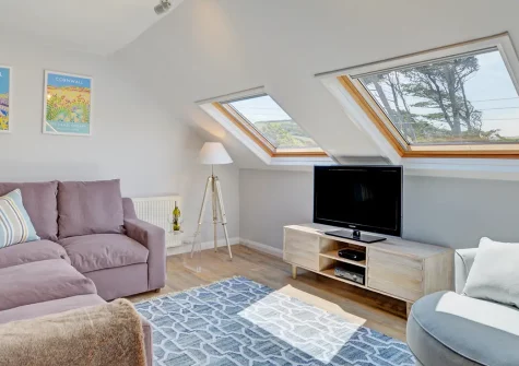 Gunnedah Studio, Crackington Haven is a stylish 2-bedroom coastal cottage with stunning sea views. Perched directly on the coastal path, enjoy contemporary interiors, a private deck, and easy access to sandy beaches and Cornish attractions.