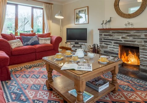 Gwella, Roserrow, Polzeath is a four bedroom holiday cottage with spacious deck & gardens adjoining Roserrow Lakes. Comfortable and well equipped it has a sitting room with open fire, conservatory,parking & outdoor games room. Close to The Point Spa.