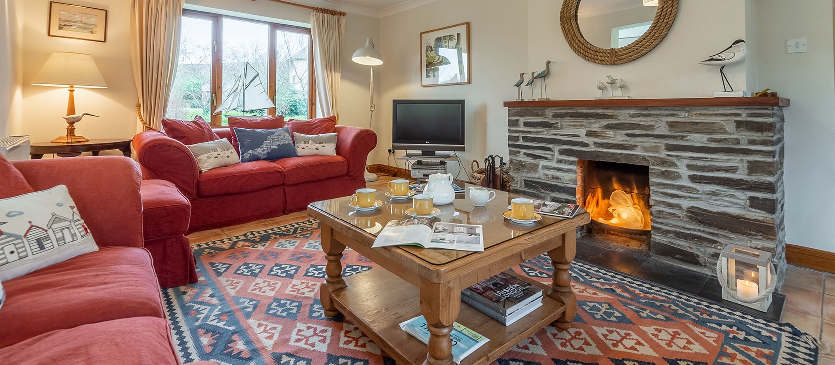 Gwella, Roserrow, Polzeath is a four bedroom holiday cottage with spacious deck & gardens adjoining Roserrow Lakes. Comfortable and well equipped it has a sitting room with open fire, conservatory,parking & outdoor games room. Close to The Point Spa.