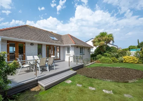 The decked patio, outdoor sitting area & rear garden at Gwyns An Mor, Marazion