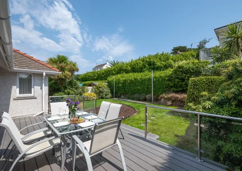 The decked patio, outdoor sitting area & rear garden at Gwyns An Mor, Marazion