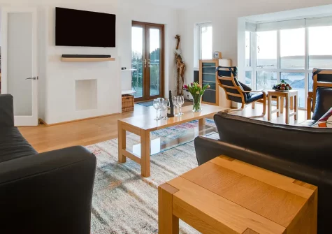 Gwyns An Mor, Marazion is a stunning four-bedroom coastal retreat with breathtaking panoramic St Michael's Mount views. Enjoy modern luxury, beautifully landscaped private gardens, and Cornwall's treasures - perfect for unforgettable holidays.