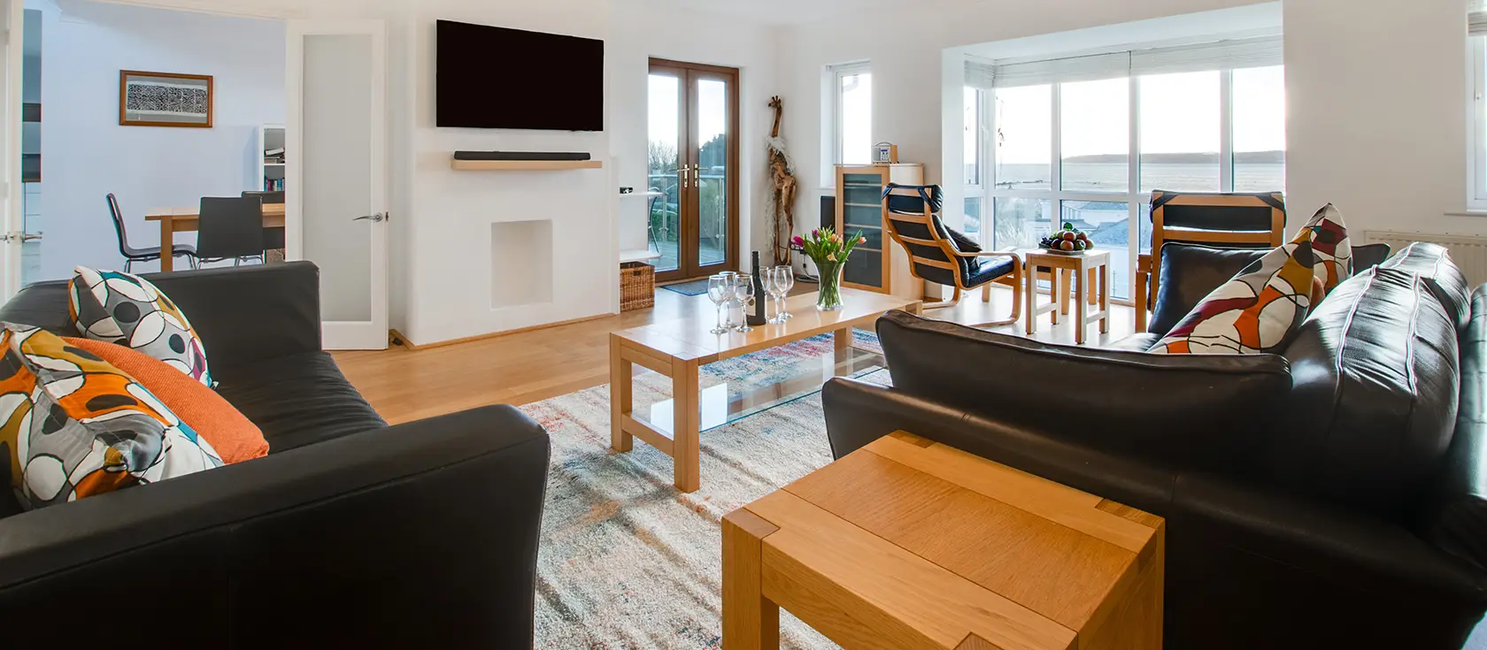 Gwyns An Mor, Marazion is a stunning four-bedroom coastal retreat with breathtaking panoramic St Michael's Mount views. Enjoy modern luxury, beautifully landscaped private gardens, and Cornwall's treasures - perfect for unforgettable holidays.