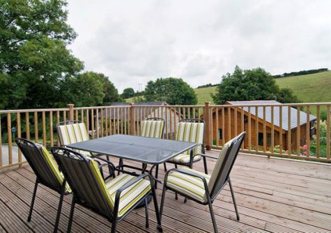 The large decked area @ Hadleigh Lodge with scenic valley views