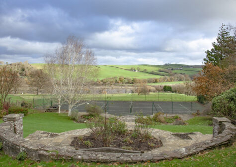 The garden & tennis court at Hallsanery House, Landcross
