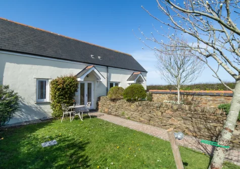 The enclosed garden & alfresco dining area at Happy Days, Padstow