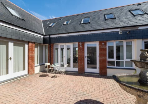 The shared courtyard & outdoor sitting area at Happy Days, Padstow