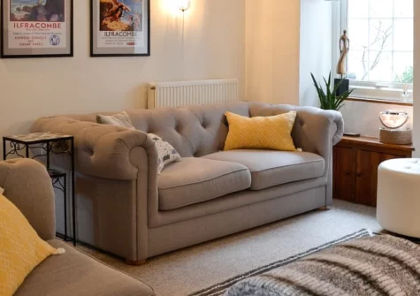 Harbour Hideaway, Ilfracombe is a characterful fisherman's cottage dating to 1750, featuring a private hot tub on the roof terrace, oak beams and exposed stone walls, moments from the harbour and Tunnels Beaches in this classic Devon resort.