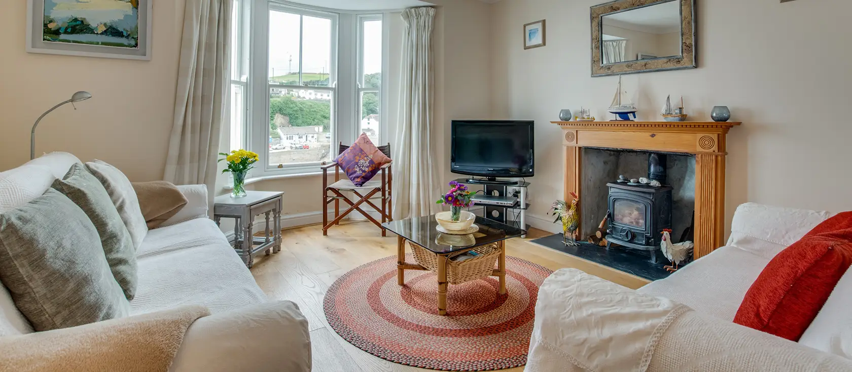 Harbour Lights, Porthleven is a Grade II-listed seaside haven with unrivalled harbour views. Enjoy three bedrooms, spacious living area with wood burner, and stunning patio overlooking the sea, perfect for unforgettable family memories.