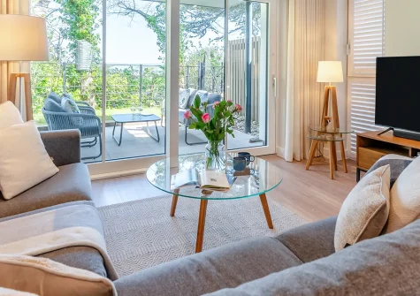Harbour Reach, Padstow is a stylish 2-bedroom ground-floor apartment with stunning Camel Estuary views. Enjoy contemporary Scandi interiors, a private garden, and you're moments from Padstow's harbour and restaurants, perfect for coastal escapes.