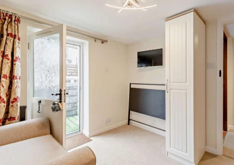 The snug, with access to rooftop terrace, at Harbour's Call, Polperro