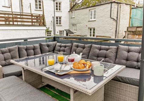The rooftop terrace & alfresco dining area at Harbour's Call, Polperro