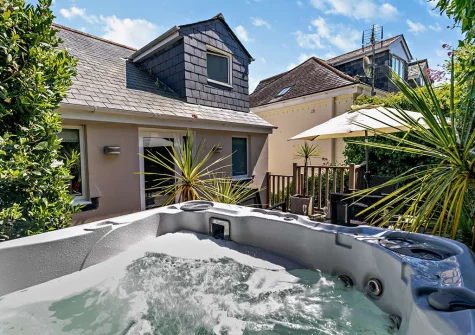 The rear garden, outdoor sitting area & hot tub at Harbour's Reach, Fowey