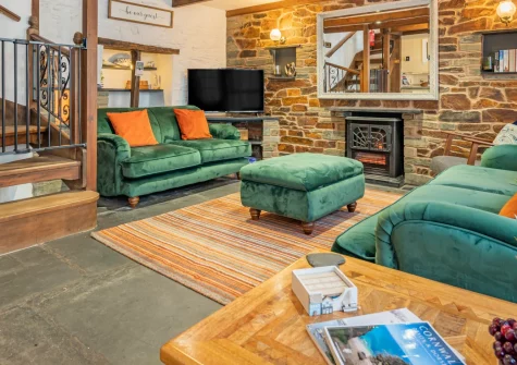 Harbourside Cottage, Padstow is a characterful 200-year-old retreat positioned right on the working harbour, featuring cosy period interiors, three comfortable bedrooms, and direct access to waterfront dining and the traffic-free Camel Trail.