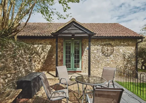 The patio & alfresco dining area at Harcombe Cottage, Furley Cottages, Furley