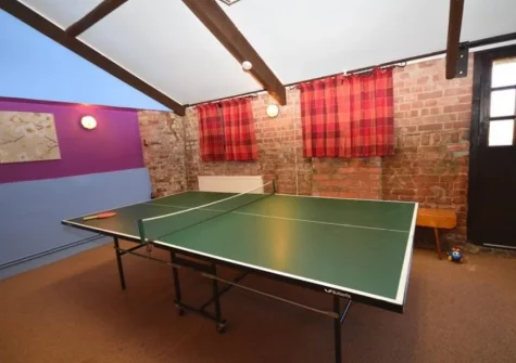 The games room with table tennis at Harris Fam, Talaton