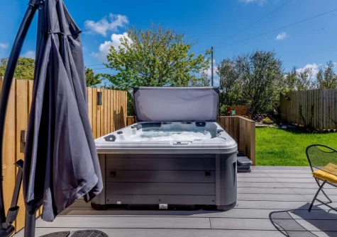 The decked patio & hot tub at Hartnolls Lodge, Woolacombe
