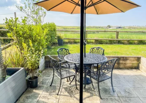 The patio, barbecue, alfresco dining area & garden at Harvest Cottage, Padstow