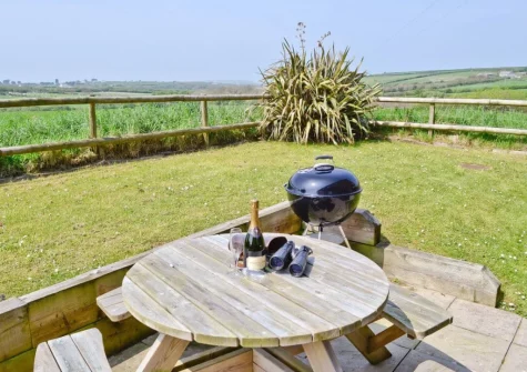 The patio, barbecue, alfresco dining area & garden at Harvest Cottage, Padstow