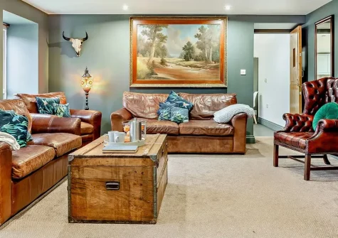 Hayloft, Arscott, Holsworthy is a stunning six-bedroom barn conversion with heated hot tub and gardens, perfect for large family gatherings. Enjoy rural charm on the Devon-Cornwall border, near to Bude's beaches and countryside attractions.