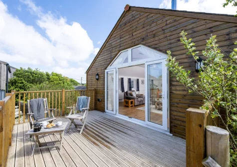 The decked balcony & outdoor sitting area at Hayloft at Trevissick Farm, Porthtowan