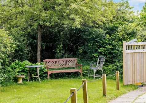 The garden & outdoor sitting area at Haytor Vale Lodge, Haytor