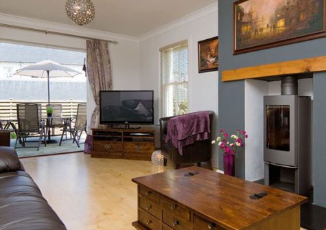 The living area @ Headland Views, Newquay gives access to the sundesck