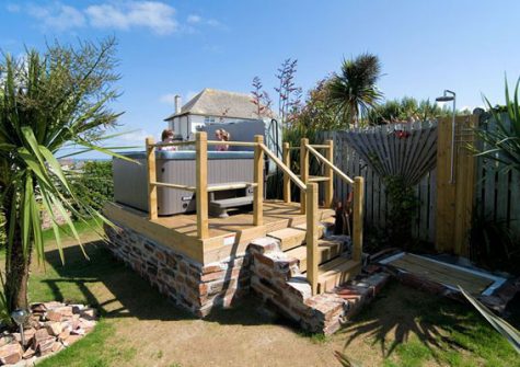 Relax in the garden or unwind in the private hot tub @ Headland Views, Newquay