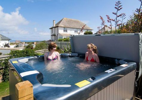 Take in the sea views from the hot tub @ Headland Views, Newquay