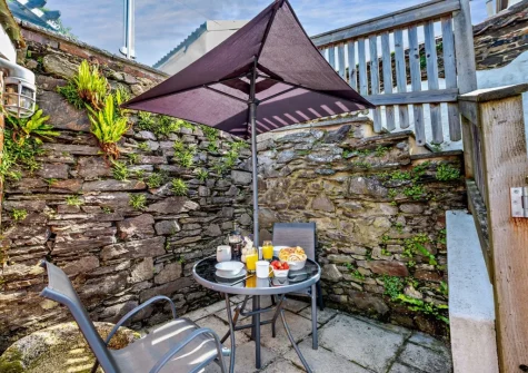 The enclosed patio & outdoor sitting area at Heanton Cottage, Braunton