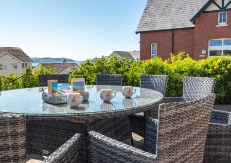 The south-facing patio & alfresco dining area at Heather Lea, Woolacombe