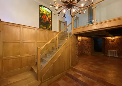 Stairs up to the bedrooms at Heddon Valley Farmhouse, Killington