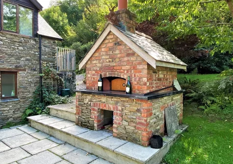 The patio & outdoor pizza oven at Heddon Valley Farmhouse, Killington