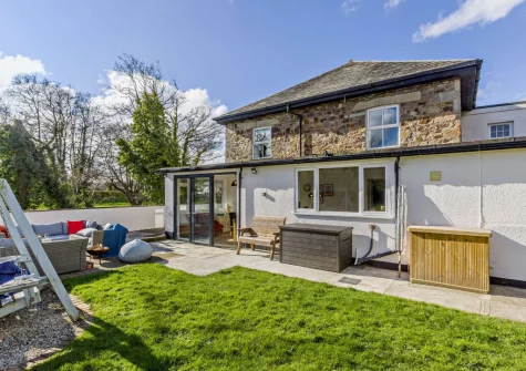 The patio, outdoor sitting area & garden at Helebridge House, Marhamchurch