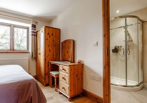Bedroom #1 & en-suite shower room at Heritage Cottage, Bokiddick