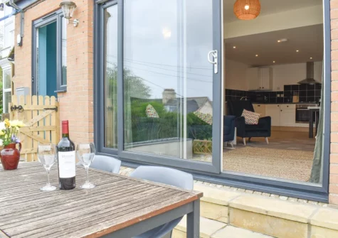 The patio garden & alfresco dining area at High Tide, Combe Martin