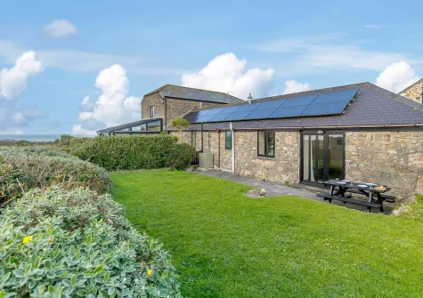 The patio, babecue, alfresco dining area & rear garden at Highcliff Cottage, Sennen