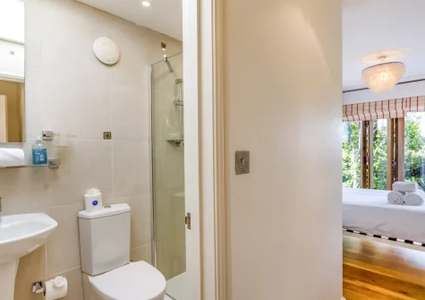 Bedroom #4 & en-suite shower room at Higher Close, Mawgan Porth