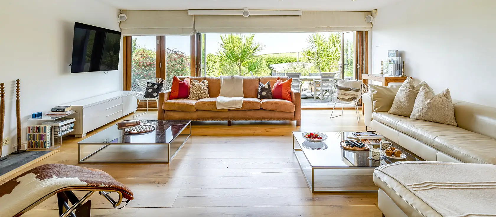 Higher Close, Mawgan Porth is a spacious beachside home with four en-suite bedrooms, home cinema, and mature gardens with pizza oven. Steps from the beach, it's ideal for families and couples seeking seaside charm and sophisticated coastal comfort.