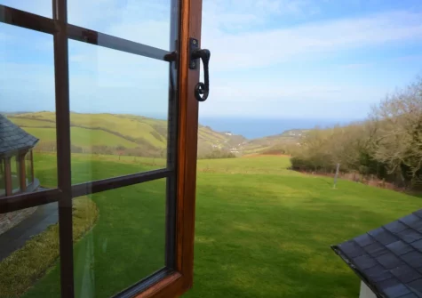 Enjoy fantastic far-reaching countryside views from bedroom #1 at Higher Hodges Farmhouse, Combe Martin