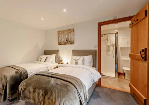 Bedroom #4 & en-suite shower room at Higher Hodges Farmhouse, Combe Martin