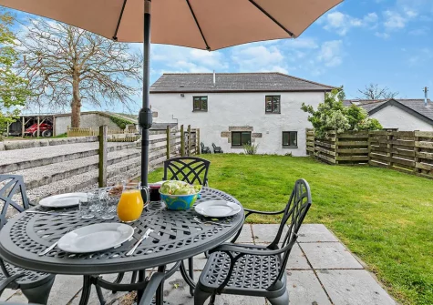 The patio & alfresco dining area at Higher Merrose, Marys Well
