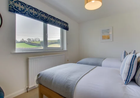 Bedroom #4 at Higher Treliver Farmhouse, St Wenn