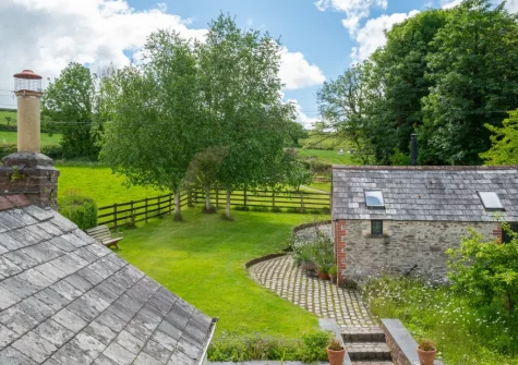 The garden with paddock-style fencing at Higher Treliver Farmhouse, St Wenn